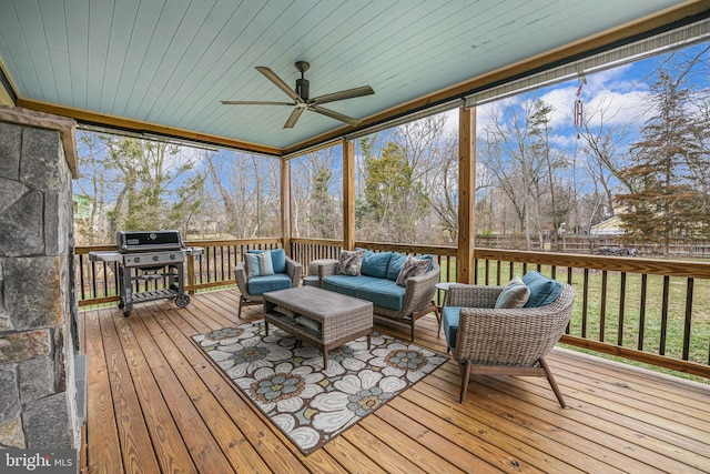 sunroom featuring wooden ceiling and ceiling fan