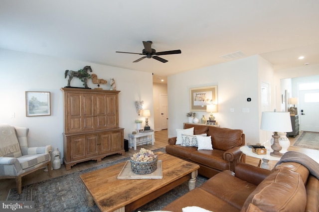 living room with recessed lighting, visible vents, ceiling fan, and wood finished floors