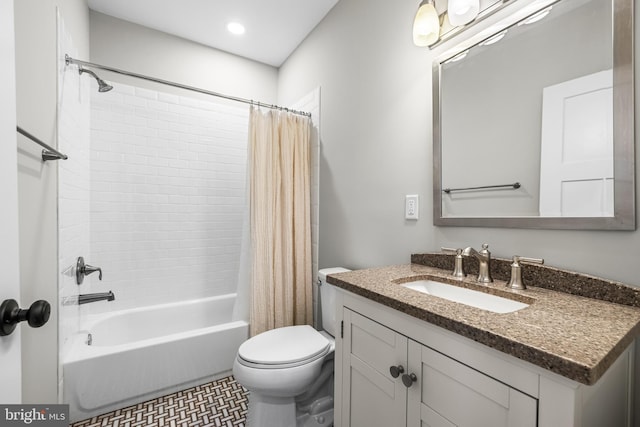 full bathroom featuring vanity, shower / tub combo, and toilet