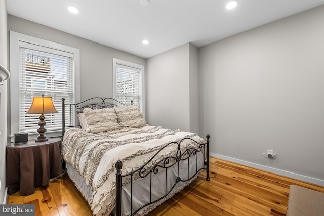 bedroom with wood-type flooring