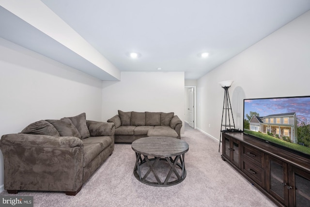 living room featuring light carpet