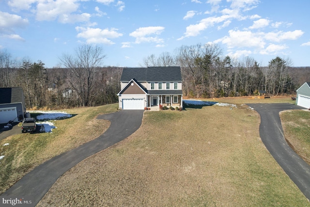 view of front facade featuring a front yard and covered porch