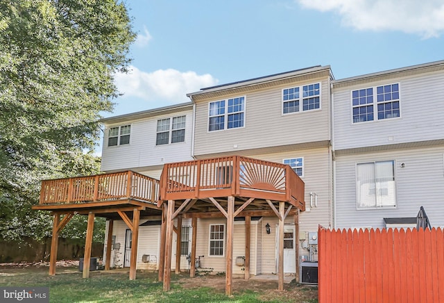 rear view of property with a wooden deck