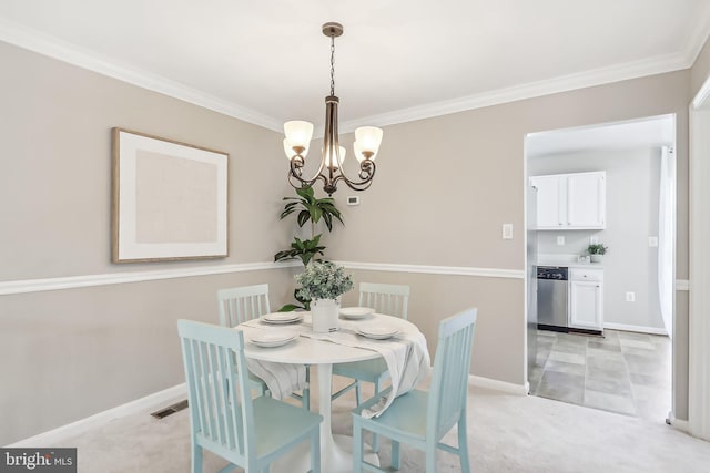 carpeted dining room with ornamental molding and an inviting chandelier