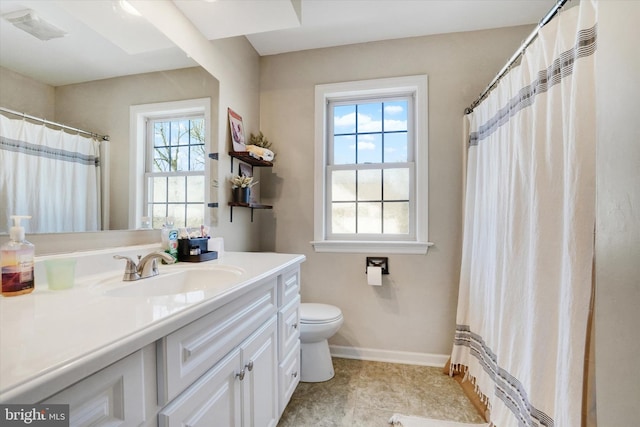 bathroom with vanity, a shower with shower curtain, and toilet