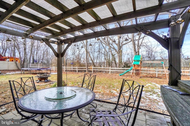 view of patio / terrace with a playground and a trampoline