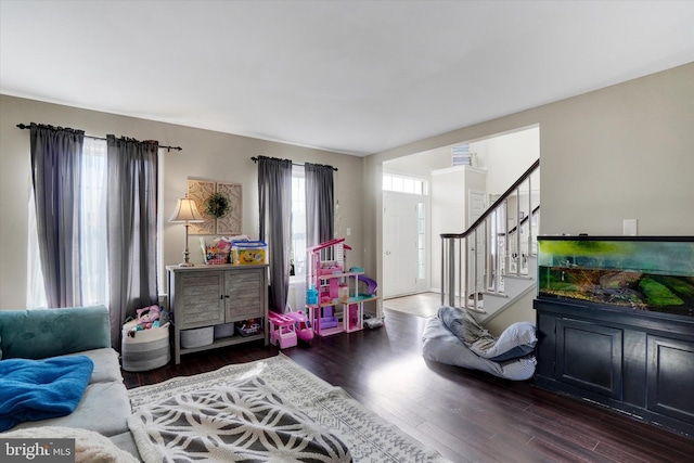 game room featuring dark hardwood / wood-style flooring