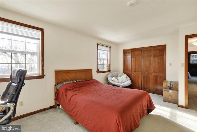 carpeted bedroom featuring a closet