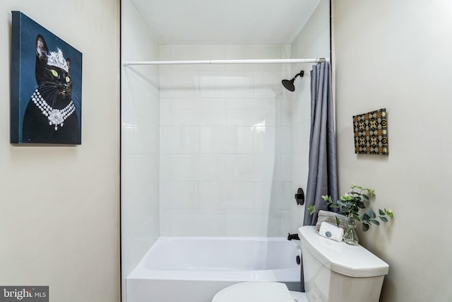 bathroom with toilet and shower / tub combo