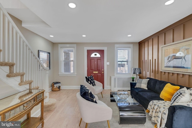 living room featuring radiator and light wood-type flooring