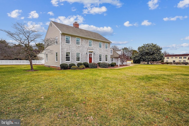 back of house featuring a yard