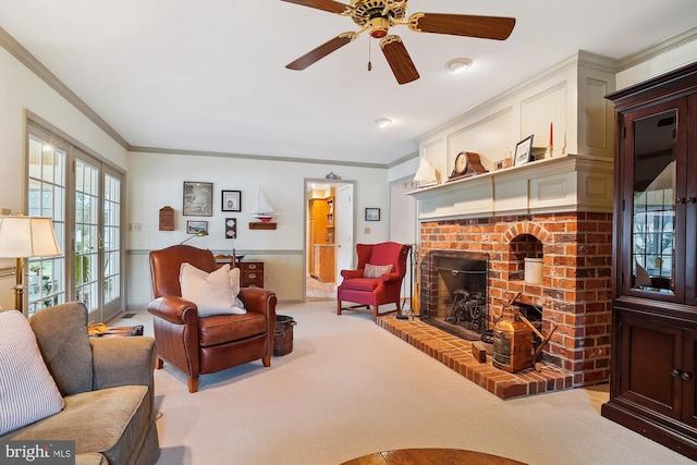 living room with ornamental molding, a brick fireplace, and light colored carpet