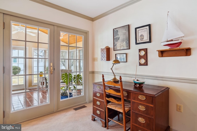 office area featuring french doors, crown molding, and light carpet