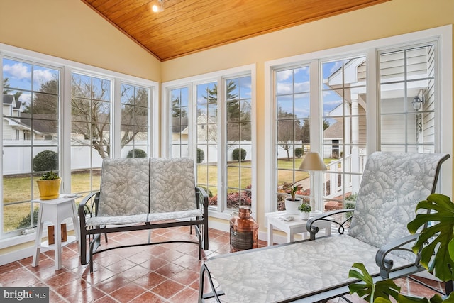 sunroom featuring vaulted ceiling and wooden ceiling