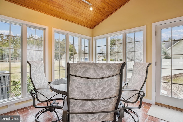 sunroom featuring vaulted ceiling and wooden ceiling