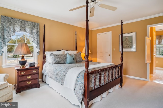 bedroom featuring crown molding, light colored carpet, and ceiling fan