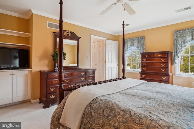 carpeted bedroom with ceiling fan and ornamental molding