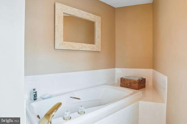 bathroom with tiled tub