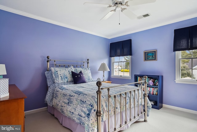 carpeted bedroom with multiple windows, crown molding, and ceiling fan