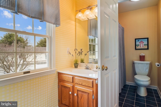 bathroom with vanity, tile patterned floors, and toilet