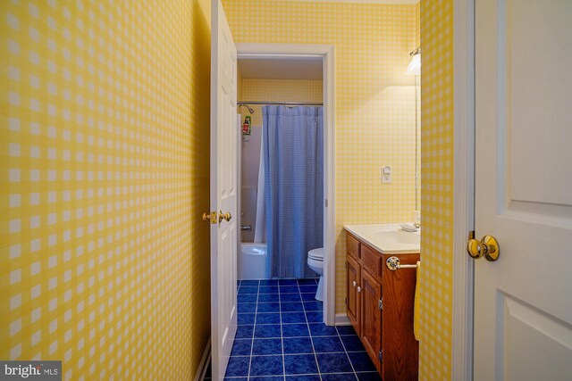 bathroom with tile patterned floors, toilet, curtained shower, and vanity