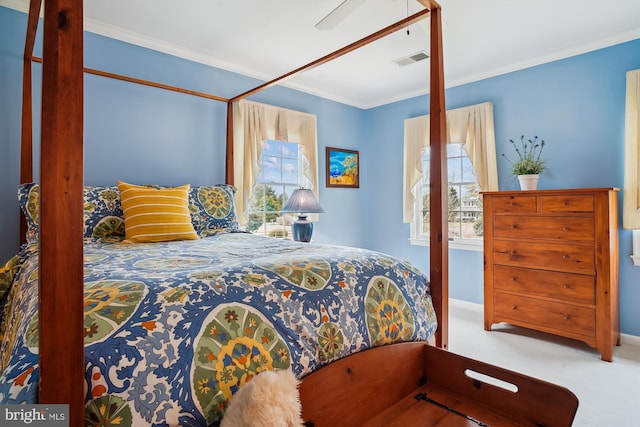 bedroom with crown molding and carpet flooring