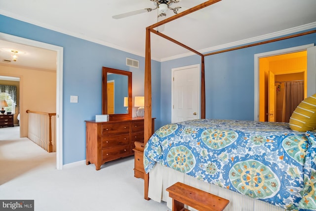 carpeted bedroom featuring ornamental molding and ceiling fan