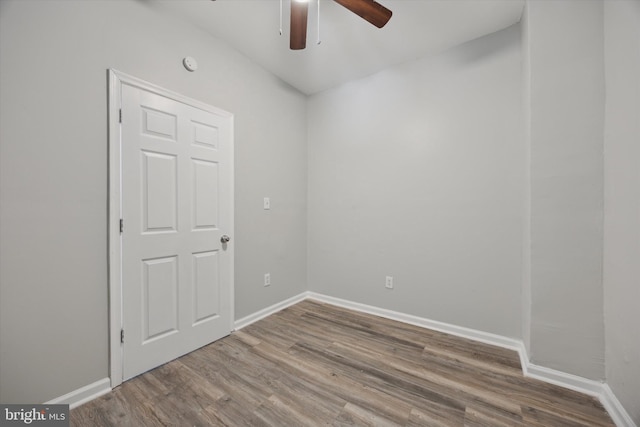 unfurnished room with hardwood / wood-style floors and ceiling fan