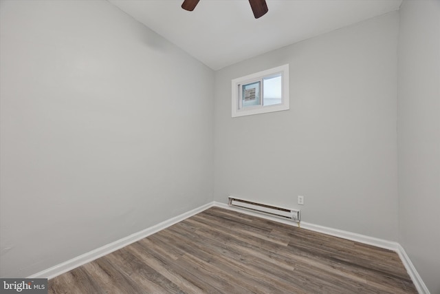 unfurnished room featuring hardwood / wood-style flooring, a baseboard radiator, ceiling fan, and vaulted ceiling