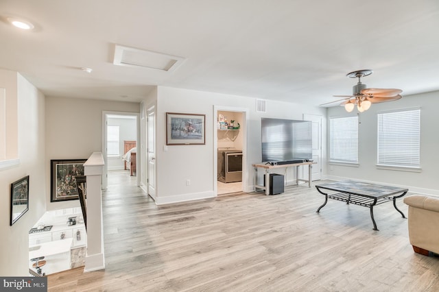 living room with light hardwood / wood-style flooring