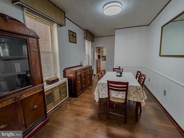 dining area featuring dark wood-type flooring