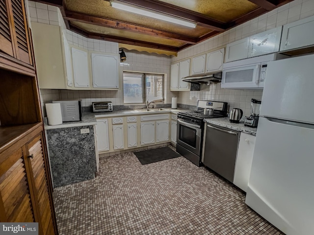 kitchen featuring tasteful backsplash, white cabinetry, sink, stainless steel appliances, and beam ceiling