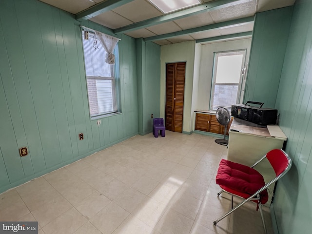 sitting room with beam ceiling