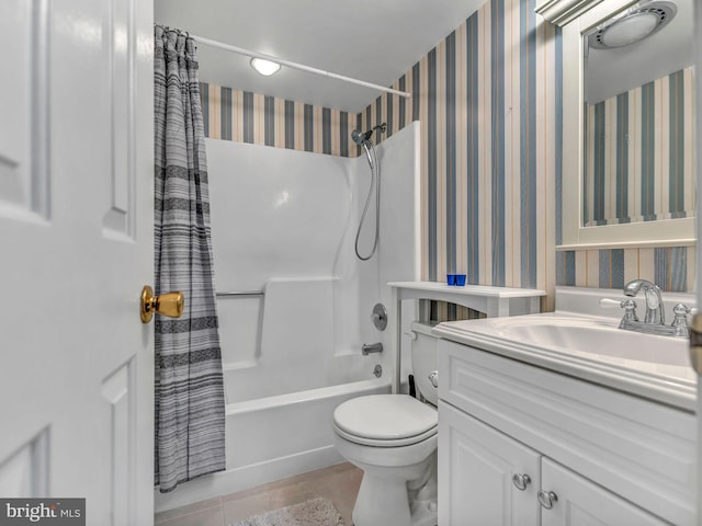 full bathroom featuring vanity, toilet, tile patterned flooring, and shower / bath combo with shower curtain