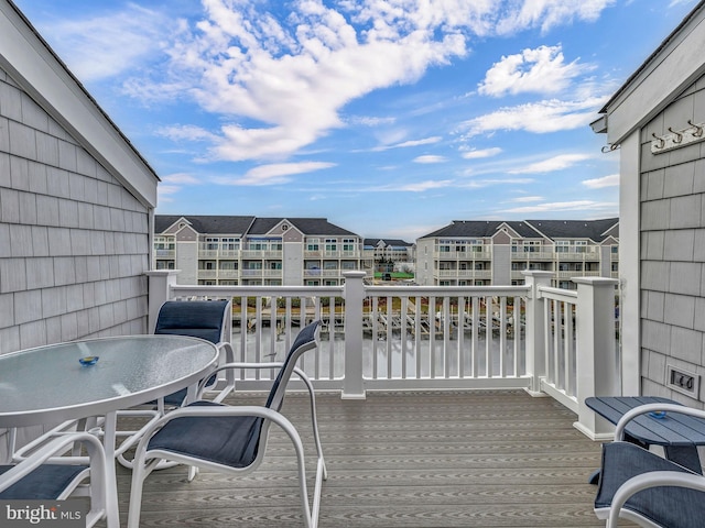 wooden deck featuring a water view