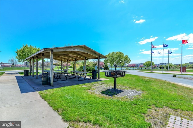 surrounding community with a yard and a gazebo