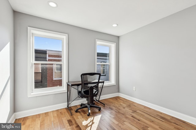 home office with light wood-type flooring