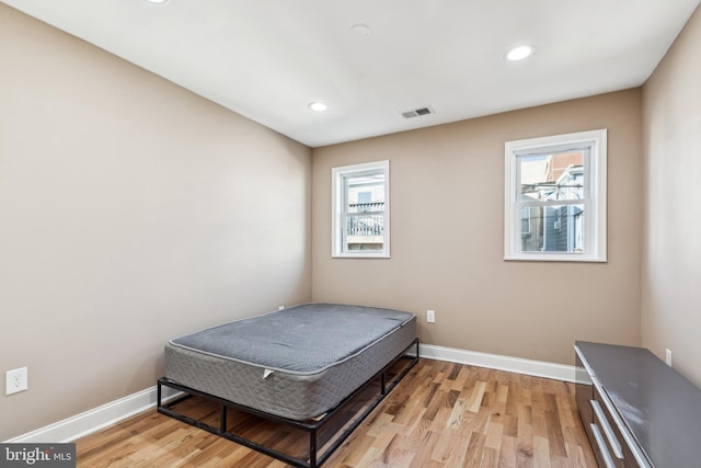 bedroom with light wood-type flooring