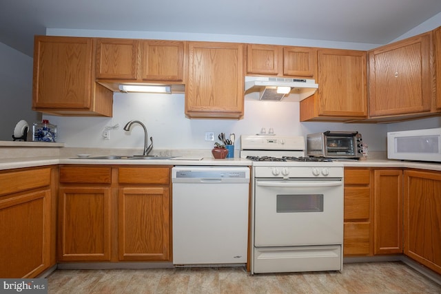 kitchen featuring sink and white appliances