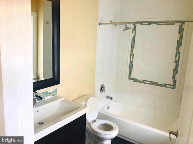 full bathroom with vanity, toilet, and tiled shower / bath combo