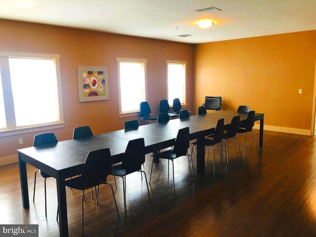 dining area featuring dark hardwood / wood-style flooring