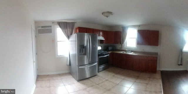 kitchen featuring sink, a wall mounted AC, and stainless steel appliances