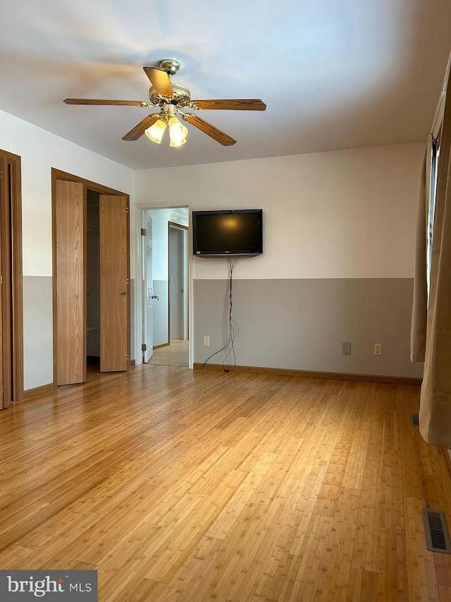 interior space with light hardwood / wood-style flooring and ceiling fan