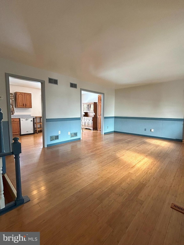 unfurnished living room featuring light hardwood / wood-style flooring