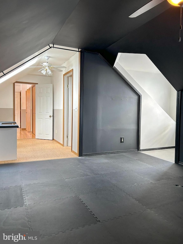 bonus room featuring lofted ceiling and ceiling fan