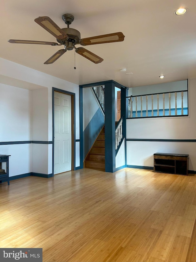 spare room featuring ceiling fan and hardwood / wood-style floors