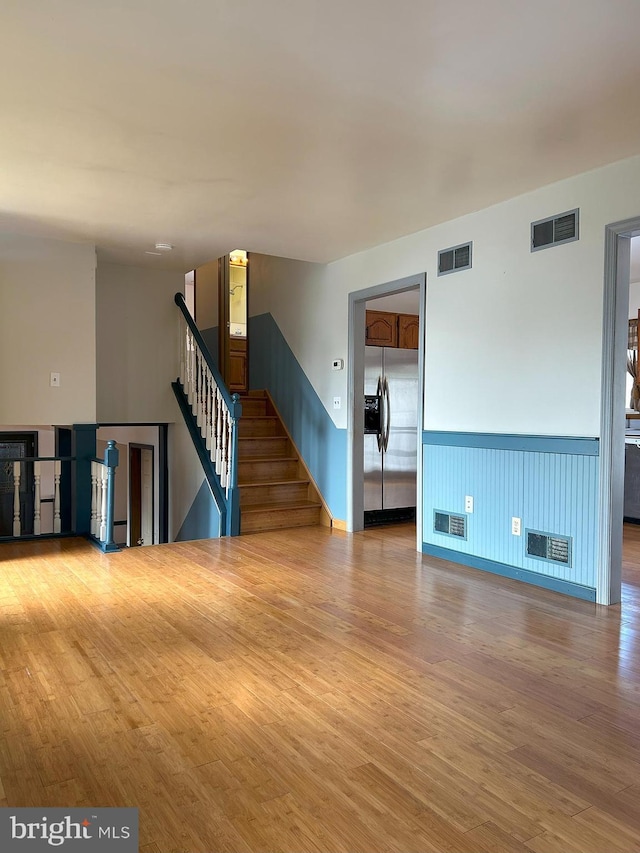 unfurnished room featuring wood-type flooring