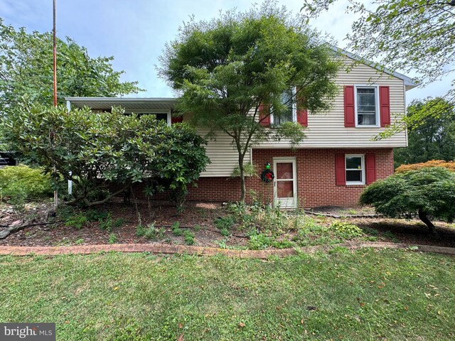 1941 Cedar Dr, Spring Grove, PA 17362 - view of front facade with brick siding and a front lawn