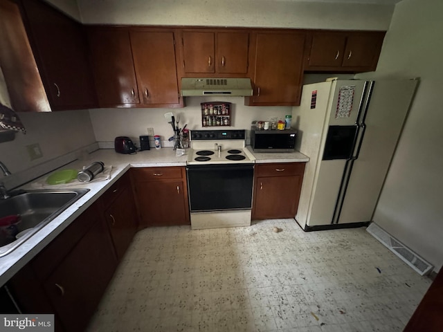 1941 Cedar Dr, Spring Grove, PA 17362 - kitchen featuring range with electric cooktop, extractor fan, white fridge with ice dispenser, light countertops, and light flooring