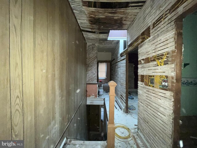 hallway with wooden walls